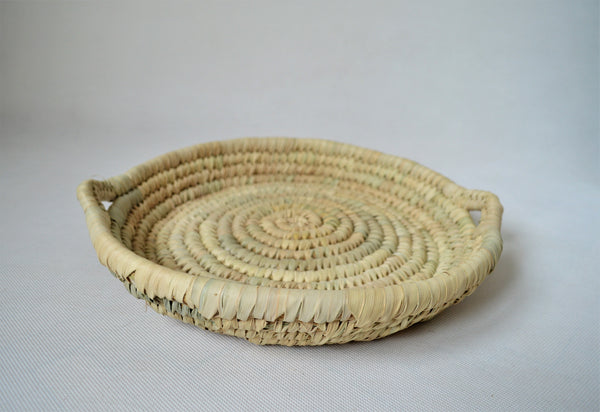 Round bread platter from palm leaves