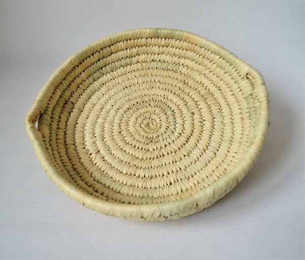 Round bread platter from palm leaves
