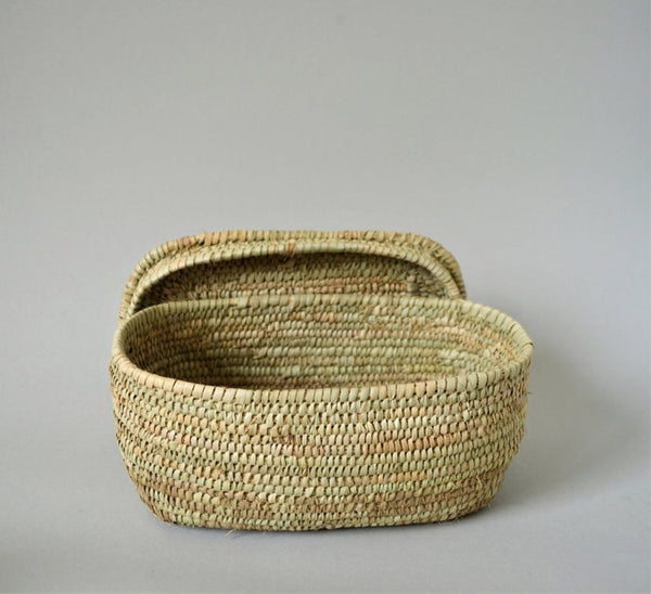 Small oval box for jewelry from palm leaves