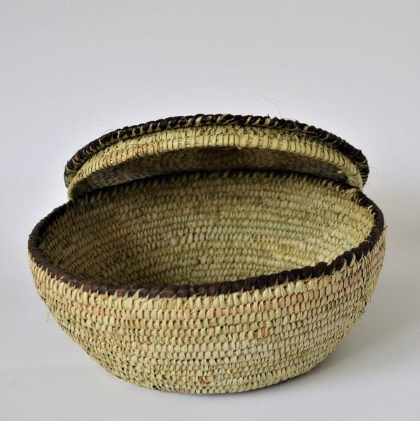 Round woven box decorated with leather