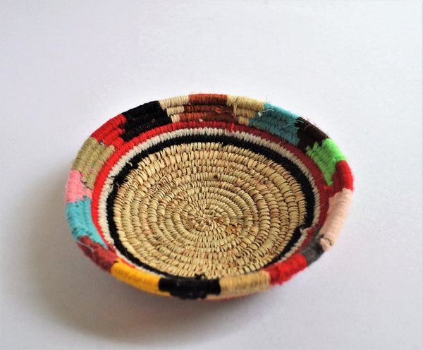 Tribal woven wall plates with wool decoration