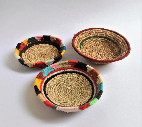 Tribal woven wall plates with wool decoration